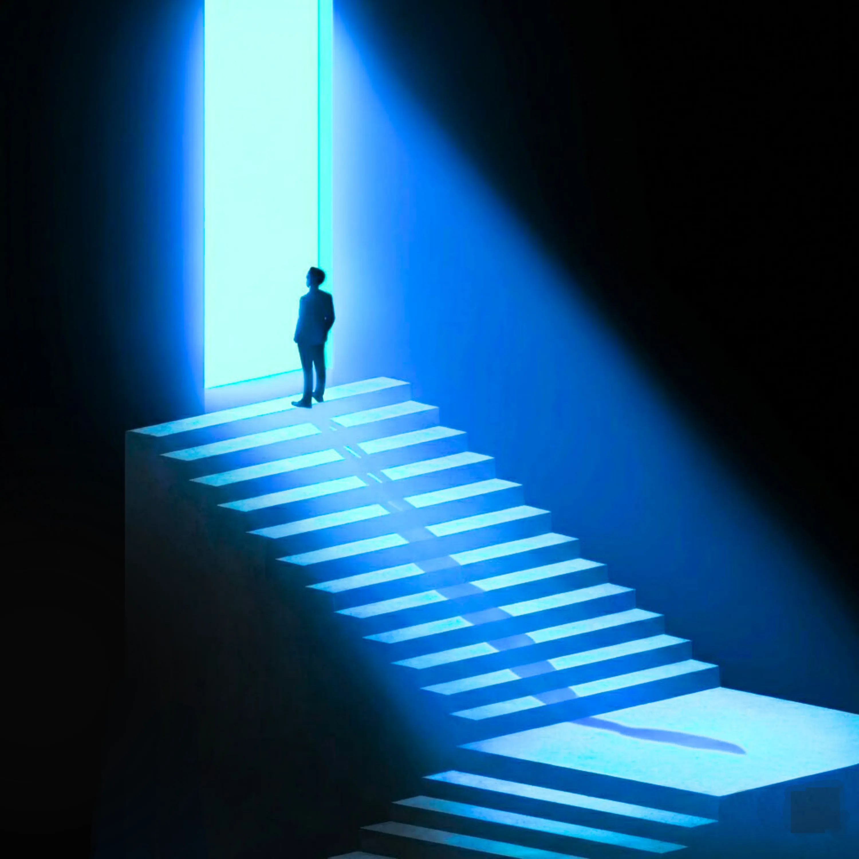 Person ascending illuminated stairway